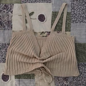 Thin, stretchy top. Good for layering in the summer or fall.
